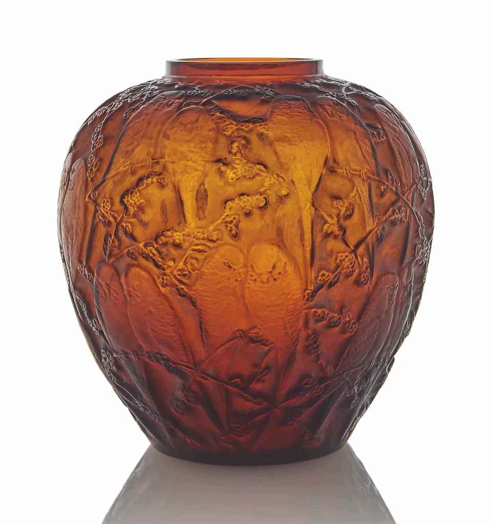 A Perruches Vase, No. 876
designed 1919, amber and white stained
10 in. (25.5 cm.) high
wheel-