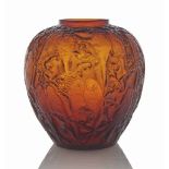 A Perruches Vase, No. 876
designed 1919, amber and white stained
10 in. (25.5 cm.) high
wheel-