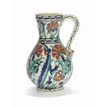 AN IZNIK-STYLE POTTERY JUG BOCH FRERES KERAMIS, BELGIUM, EARLY 20TH CENTURY Of baluster form