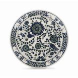 A LARGE POTTERY CHARGER IN THE IZNIK STYLE EMILE DECOEUR, FRANCE, AFTER 1902 On straight foot, the