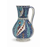 AN IZNIK-STYLE POTTERY JUG THEODORE DECK, FRANCE, LATE 19TH CENTURY Of baluster form rising from