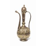 A GILT-COPPER (TOMBAK) EWER OTTOMAN TURKEY, LATE 18TH/EARLY 19TH CENTURY On conical foot, the