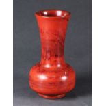 Chinese Peking glass vase, of mottled red hues imitating realgar, with a long trumpet neck above a