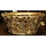 Victorian style carved gilt wood jardinere, the pierced basket having applied grape leaves and