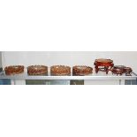 (lot of 17) Group of Chinese wood stands, of various sizes, including one square stand and the