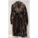 (lot of 4) Silver fox coat; autumn haze mink stole; mahogany mink stole; and a synthetic fur coat,