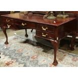 Chippendale style mahogany desk, the rectangular top having a gadrooned border, above the five