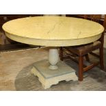 Hollywood Regency style round dining table having a faux marble painted top, rising on a single