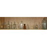 (lot of 15) Pharmacy bottles in clear glass, largest: 7.5"h. Provenance:  Property from the