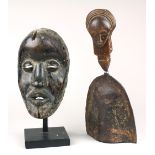 (lot of 2) Baule, Ivory Coast gong, the figural wood handle decorated with a stylized face, and