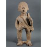 Akan, Ghana carved stone standing figure, perhaps a funerary memorial, depicting a person with a