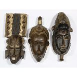 (lot of 3) Baule, Cote D'Ivoire, Guro mask, 17"h; a Yaure/Baule, Cote D'Ivoire mask, 16"h; and a