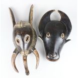 Guro/Baule, Cote d'Ivoire bushcow mask, having a glossy black face of classical Baule form, depicted