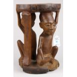 Makonde, East Africa figural stool, having a circular top above caryatid supports, 12"h. Provenance: