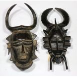 (lot of 2) Ligbi, Cote D'Ivoire and Ghana, partial pigment decorated mask, having stylized facial