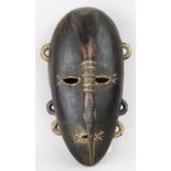 Ligbi, Cote d'Ivoire mask, with long thin hornbill coming way down from top of forehead toward chin,