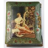 Victorian photo album fronted by a picture of a young woman playing a lute, and containing thirty