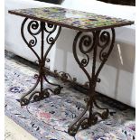 Spanish Revival wrought iron occasional table, having a mosaic glass top centered with a scenic