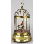 Musical mechanical automaton birdcage, with a single red finch housed in a gilt metal cage, circa