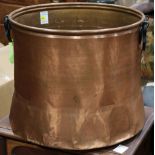 Large copper candy pot with cast iron handles, having a slightly flared base, 15"h x 19"dia.