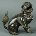 Chinese patinated bronze fu-lion censer, seated on its haunches with its right front leg lifted, the