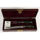 (lot of 3) Rive-King Company jade handled carving fork and knife resting in a rosewood fitted box