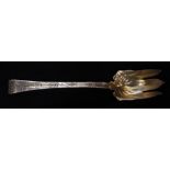 American Tiffany & Company sterling silver-gilt acid etched serving fork in the "Lap Over Edge"