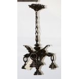 Gothic Revival figural winged griffin hanging chandelier, 19th Century, having three stylized gothic