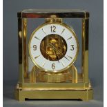 Jaeger Lecoultre Atmos clock, having a brass with glass paneled case, the circular dial with