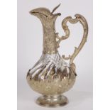 French Baroque style crystal claret jug, the swirl fluted bottle mounted with .800 silver sculpted