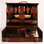 Men's traveling and grooming case, 1923, consisting of chromium-plated and wood handle brushes,