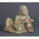 Chinese soapstone sculpture, of a monk seated in royal ease, holding a string of prayer beads to the