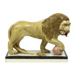 Large Staffordshire lion, 18th century, depicted with mouth open, and foot resting on ball, the