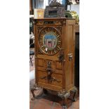 25¢ Mills Dewey upright color wheel slot machine, 1913, the quarter sawn oak case surmounted by an