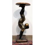 Venetian Blackamoor figural stand, 19th century, having a circular top, above the carved wood and