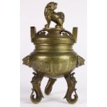Chinese brass tripod censer, compressed body flanked with lion head handles, raised on beast form