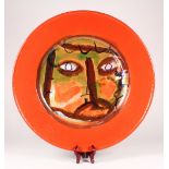 Jean Paul Van Lith glazed terracotta polychrome decorated charger, circa 2000, having an abstract