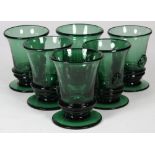 (lot of 6) Continental green glass tumblers, having a splayed rim slightly tapering to a round base,