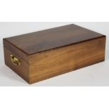 Continental walnut humidor with a hinged lid and brass handles, containing Bolivar and Monte Cruz