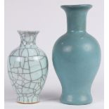 (lot of 2) Chinese ceramic vases, each similarly with a trumpet neck and tapering ovoid body, the