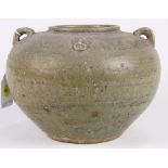Chinese celadon glazed ceramic jar, the wide shoulder with geometric bands, lug and zoomorphic