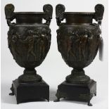 Pair of Neoclassical style patinated bronze urns, each with a baluster form with depictions of