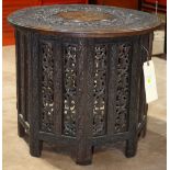 Indian wooden tabouret table, with a separate circular top, having inlaid leaves and carved with