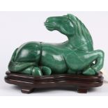 Chinese aventurine quartz stone carving of a horse, in recumbent form with head facing the back,