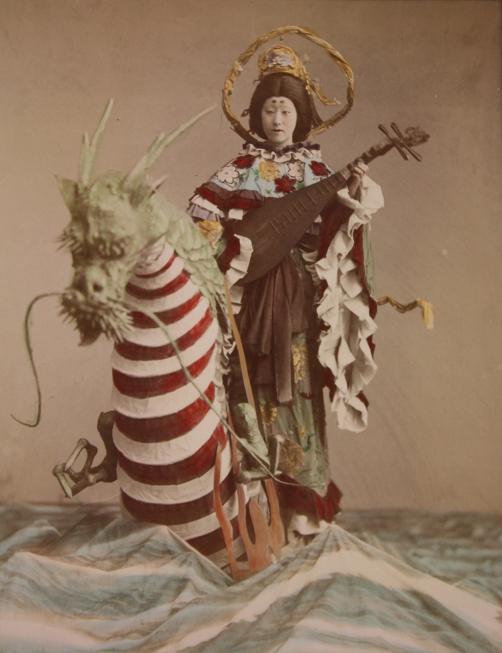 Kusakabe Kimbei (Japanese, 1841-1934), Actress with Dragon Figure, circa 1890, hand-colored