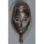 (lot of 2) Yaure, Cote d'Ivoire, finely carved mask, having an incised decorated hairline, above