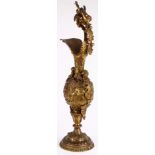 Continental Renaissance style bronze ewer, ornately molded with applied putto handle, the baluster