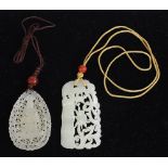 (lot of 2) Chinese jade/hardstone plaques, tear-drop form pierced with a Buddhist figure; the