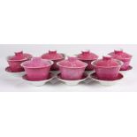 (lot of 7) Chinese pink sgraffito porcelain lidded cups and saucers, the cups having a flared rim,