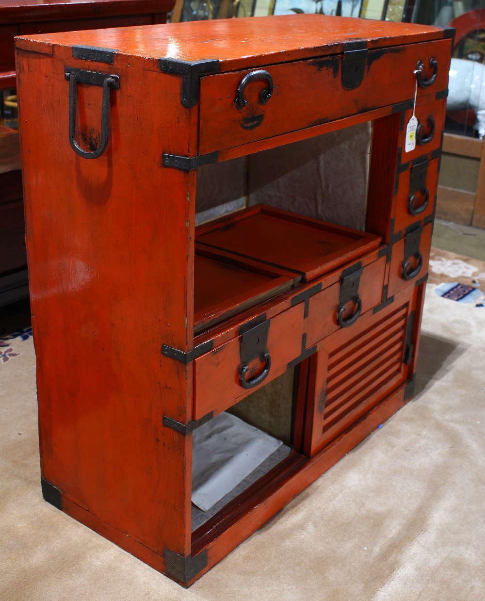 Japanese vermilion lacquered tansu, iron pole hangers on either end, a center drawer above three - Image 3 of 4